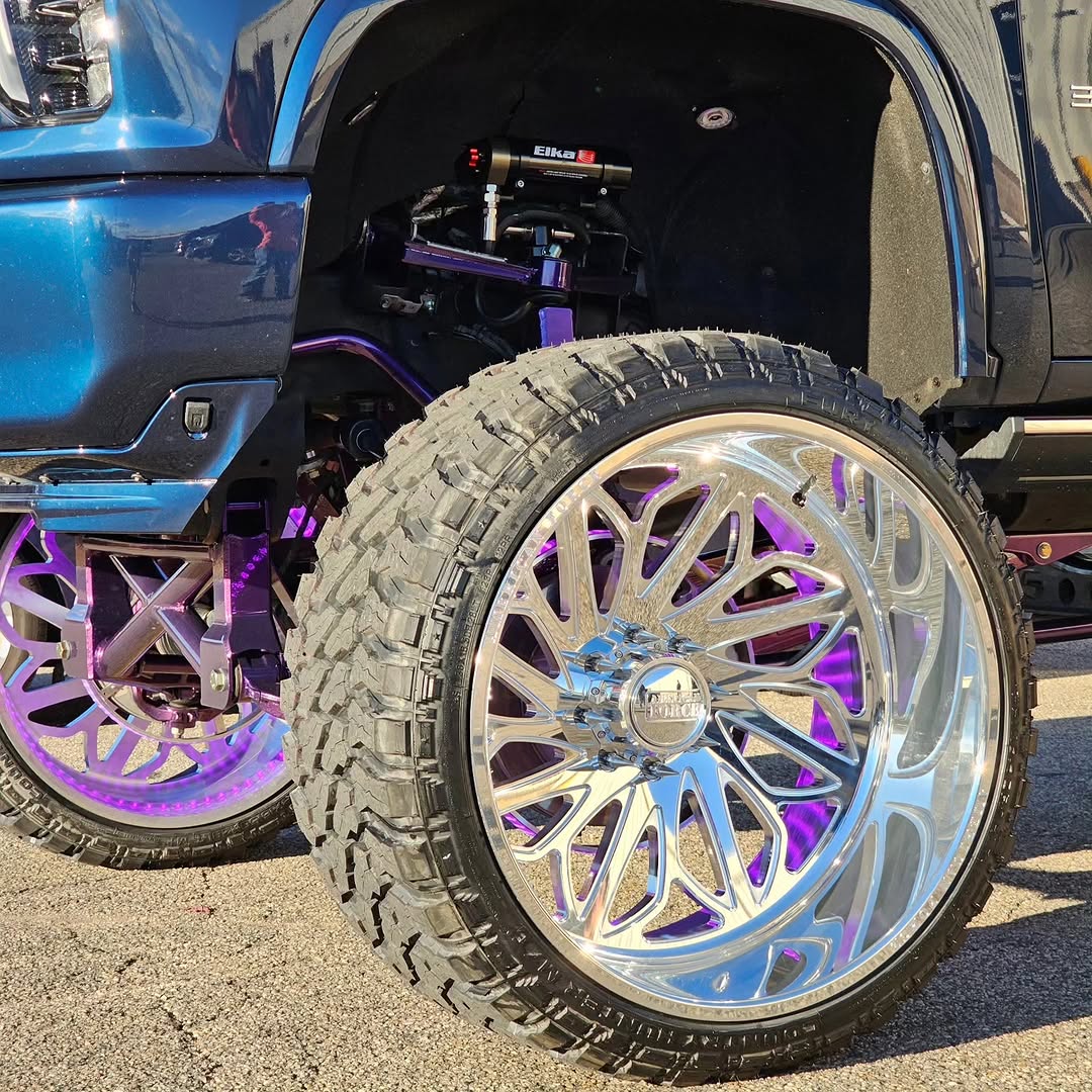 Show-finish purple suspension with underglow on American Force wheels